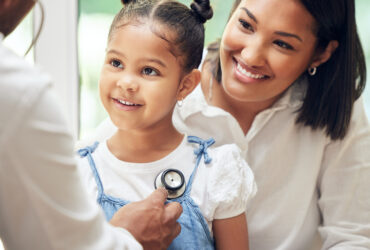 Mother, child and doctor with stethoscope for health care in a hospital for heart and lungs. African woman, pediatrician man and kid patient for medical help, family insurance or development check.